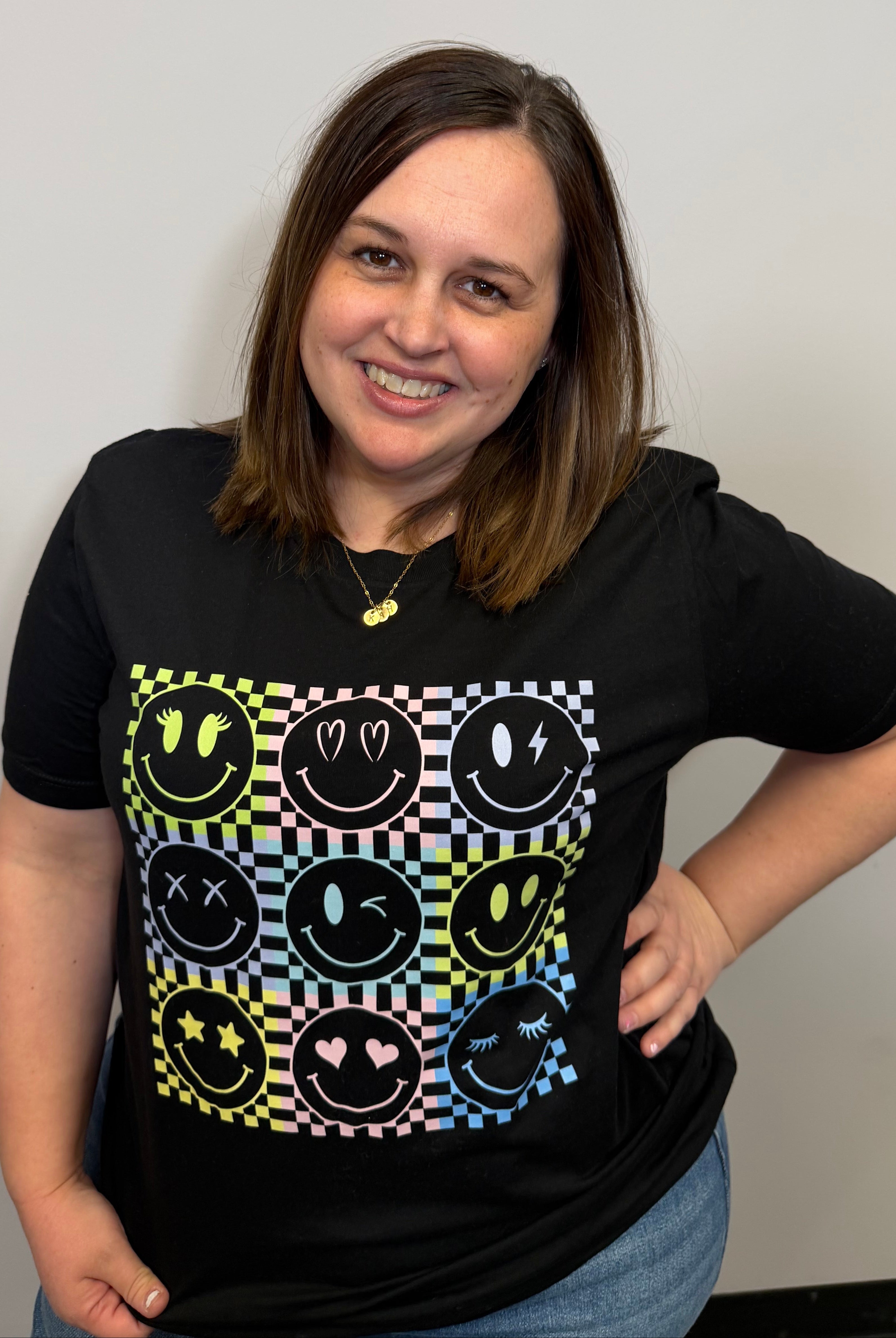 Checkered Smiley Face Graphic Tee { product_type }}