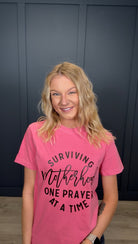 Surviving Motherhood Tee { product_type }}